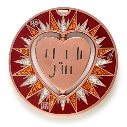 gulas geocoin, antique copper, a geocoin with a heart in the center
