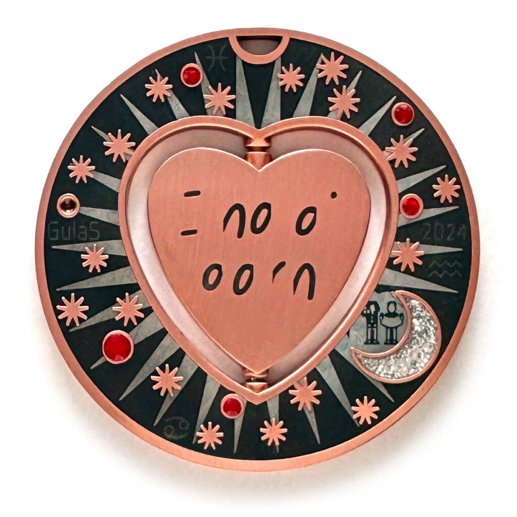 gulas geocoin, antique copper, a geocoin with a heart in the center