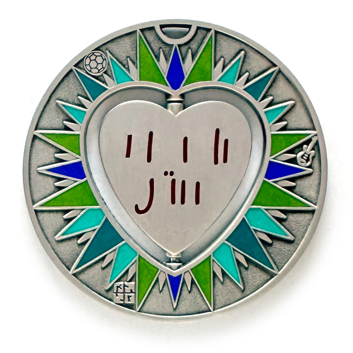 gulas geocoin, antique silver, a geocoin with a heart in the center