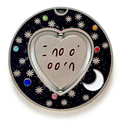 gulas geocoin, antique silver, a geocoin with a heart in the center