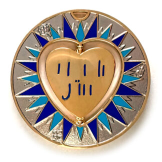 gulas geocoin, gold and nickel, a geocoin with a heart in the center