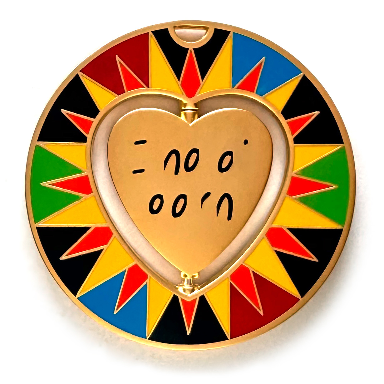 gulas geocoin, matte gold, a geocoin with a heart in the center
