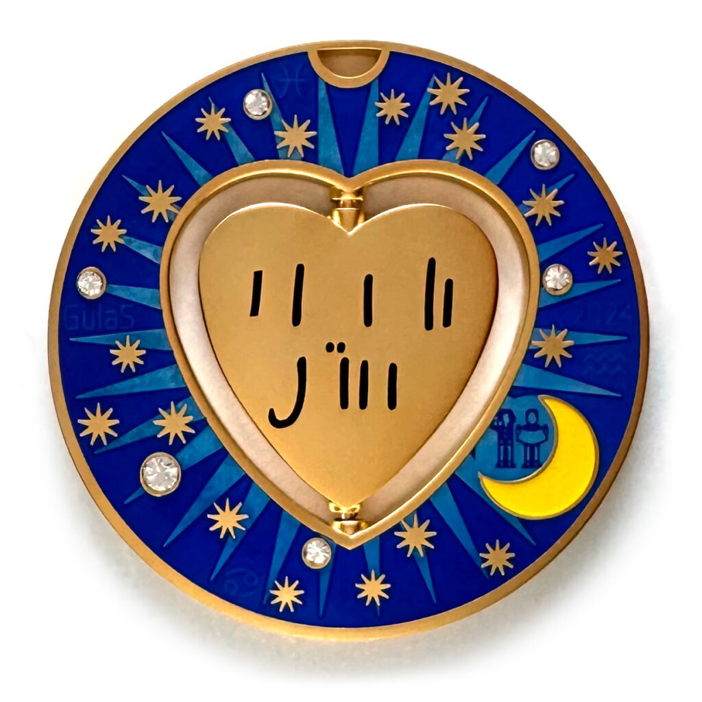 gulas geocoin, matte gold, a geocoin with a heart in the center