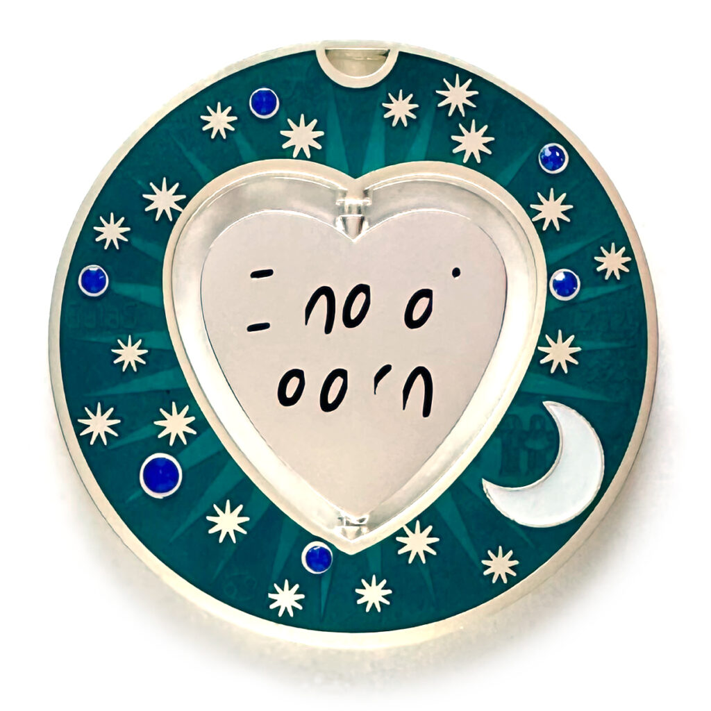 gulas geocoin, matte silver, a geocoin with a heart in the center