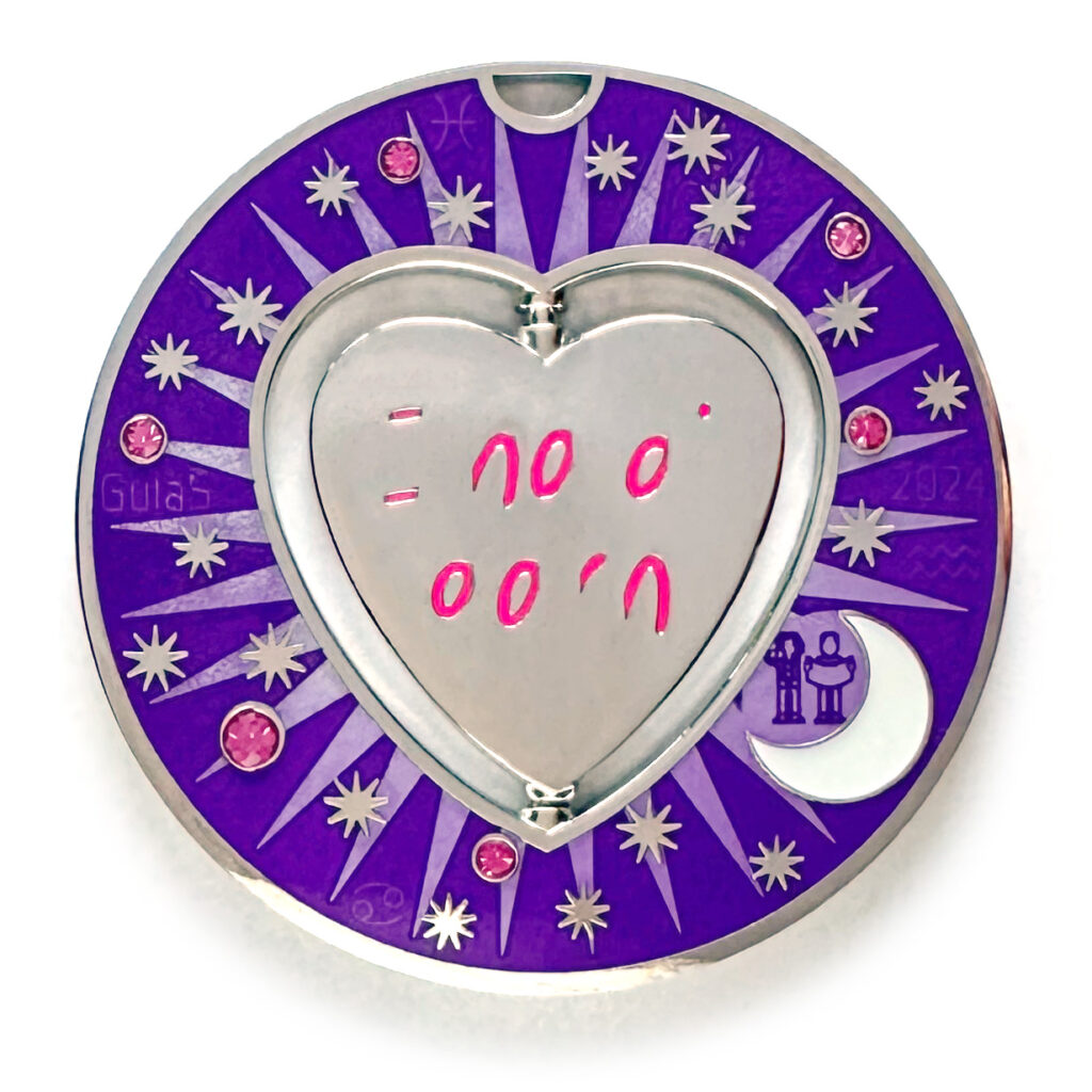 gulas geocoin, nickel, a geocoin with a heart in the center