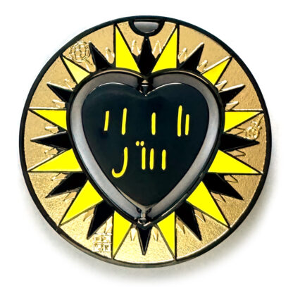 gulas geocoin, black nickel, a geocoin with a heart in the center