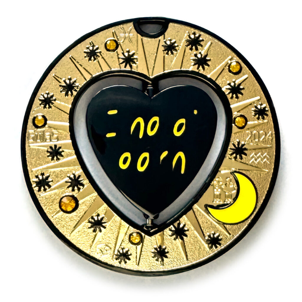 gulas geocoin, black nickel, a geocoin with a heart in the center